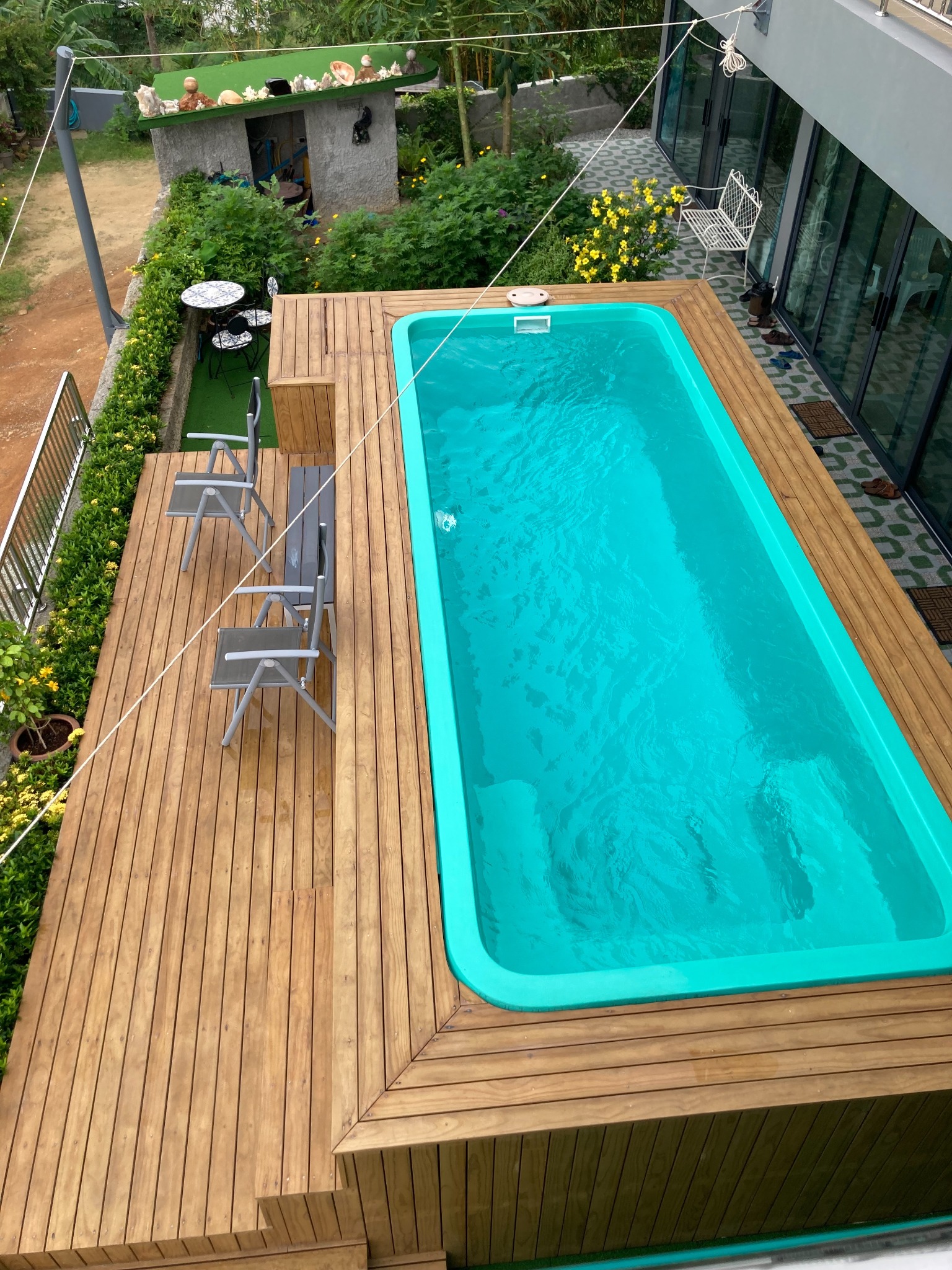 Above-ground fibreglass swimming pool